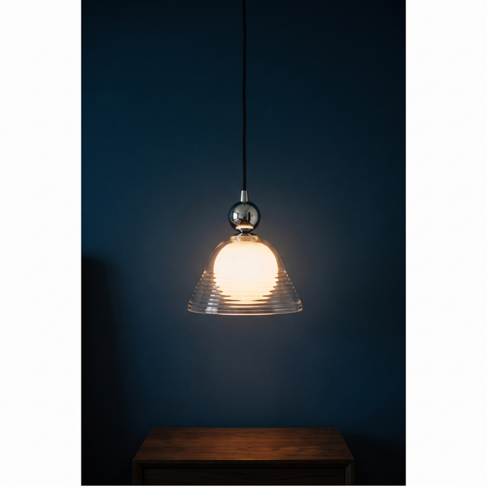 Hedda opal glass pendant light glowing warm against a deep navy bedroom wall